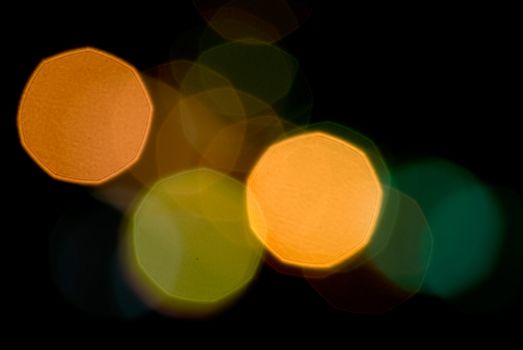 It is defocused light dots bokeh background.