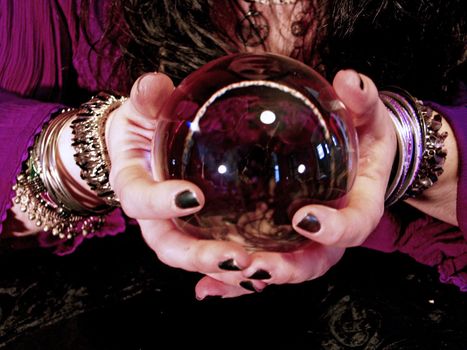 a fortune teller holding a crystal ball