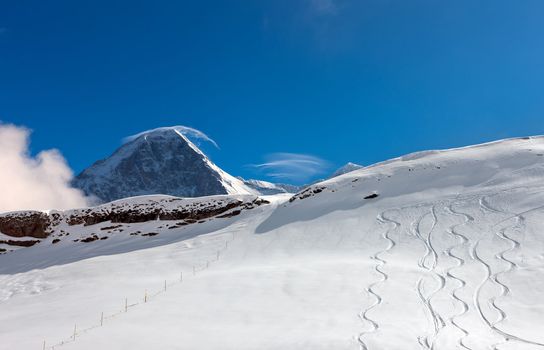 Ski slope in the background of Mount Eiger. The Eiger is a mountain in the Bernese Alps in Switzerland.