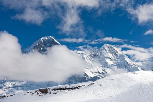 Ski slope in the background of Mount Eiger. The Eiger is a mountain in the Bernese Alps in Switzerland.