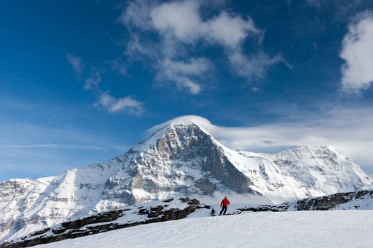 Ski slope in the background of Mount Eiger. The Eiger is a mountain in the Bernese Alps in Switzerland.