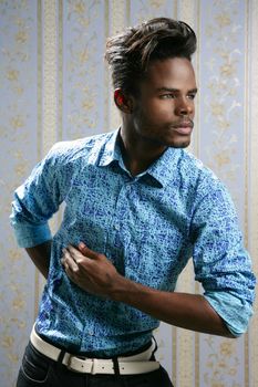 African american fashion model portrait on blue wallpaper background