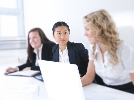 Group of business women at the office working