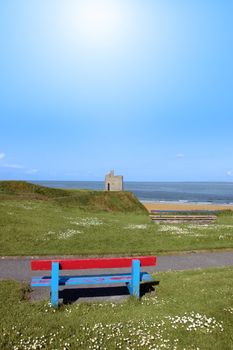 ballybunion benches in summer with view of castle beach and cliffs