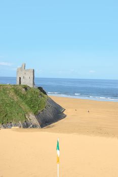 a view of the beach in ballybunion co kerry ireland with irish flag