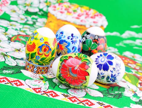 A variety of painted Easter eggs on a towel