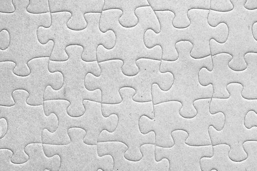 Unity:blank grey jigsaw puzzle pieces all connected, great details of textured cardboard material