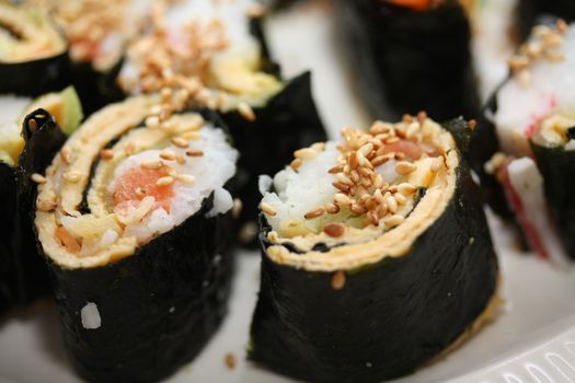 Makisuski, rice, egg and salmon rolled in seaweed, traditional Japanese cuisine
