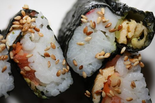 Makisuski, rice and salmon rolled in seaweed