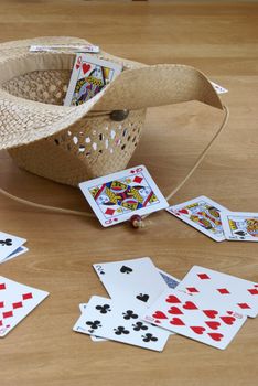 A game of tossing cards into a hat.