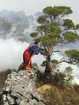 Firefighter fighting tryes to put out a fire back in  2004. The forrest caught fire when some kids played with open fire in dry nature. The fir was put out before it reached buildings nearby! Place: Ytre Arna in Bergen city of Norway!