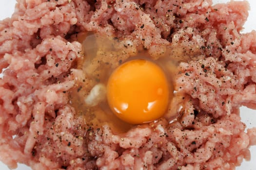 Mince meat with raw egg, close-up