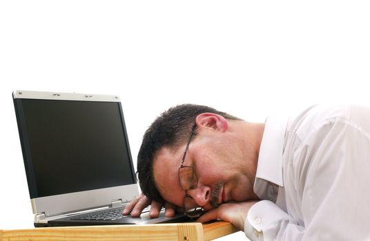 Tired businessman sleep at work with laptop isolated on white.