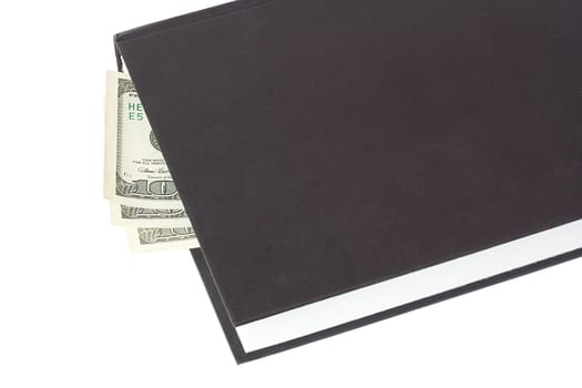 black book and money, isolated on white
