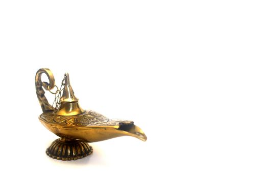 An isolated golden or bronze magic genie lamp, like Aladdins! :)