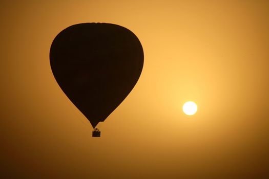 A hot air Balloon backlit by the rays of the morning Sun. 

- Luxor - Egypt