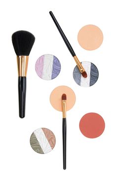 Make-up brush and powder eye shadows isolated on white background