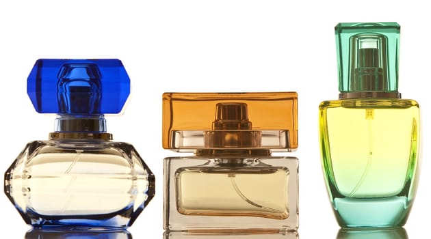 Perfume in a glass bottles on white background