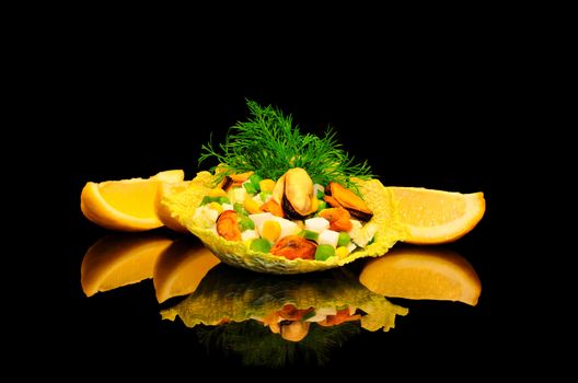 Salad of mussels with corn and peas in the leaves of savoy cabbage on a black background