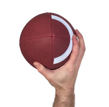 Closeup of a quarterback's hand while throwing a football