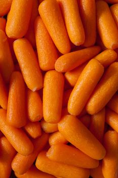 Background of raw peeled baby carrots