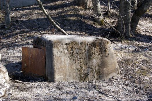 Small concrete shelter with a metal door