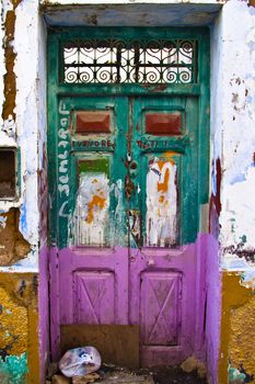 Old wooden colourful door shot in the ghetto.