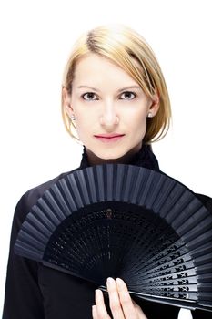 Portrait of a successful,  elegant, atractive, woman wearing black blouse holding folding fan.