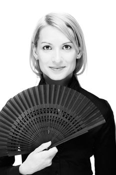 Portrait of a successful,  elegant, atractive, business woman wearing black blouse holding folding fan.