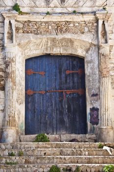 Old wooden entrance in an ancient building.