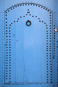 Traditional light blue, vintage, wooden, moorish door.