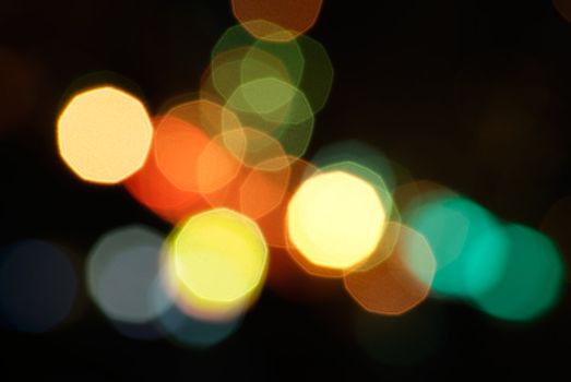 It is defocused light dots bokeh background.