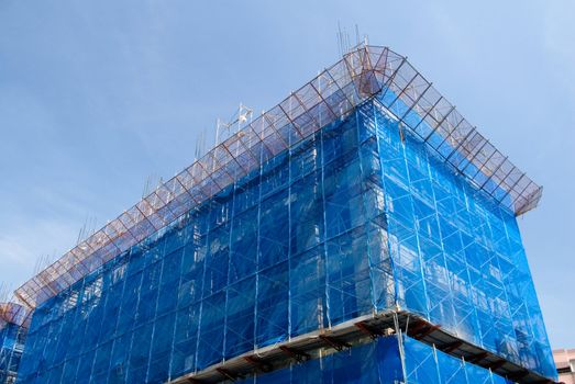 It is a blue building that under construction.