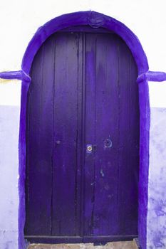 Traditional violet, vintage, wooden, mediterranean front door.