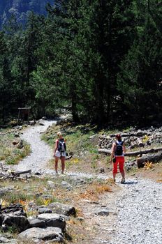 Travel photography: Samaria National Park, Crete. Two girls hiking towards 

the gorge.