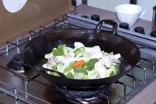Stir Fry Broccoli Cauliflower Vegetable and Pork in Asian Wok
