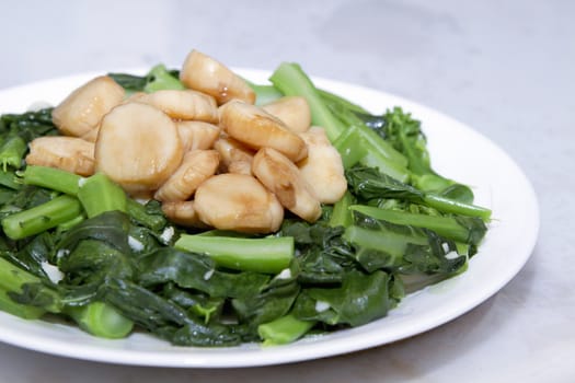 Stir Fry Seafood Scallops and Green Chinese Broccoli Vegetable Dish