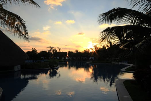 Resort pool taken at sunrise before crowd shows up