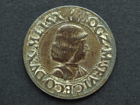 Ancient Roman coin on a black background
