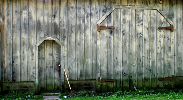 Old barn door with weathered grey planks