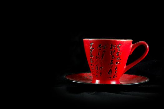 Chinese cup on a black background