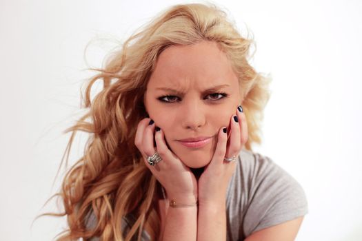 Young pretty teenage girl in studio with long hair