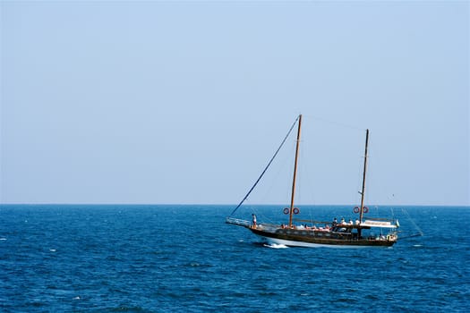Large catamaran sailing in the blue sea