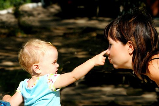 Mommy happy playing with her little daughter