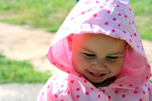 Little girl smiling and being embarrassed
