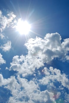 Vital flight in the free, dark blue and gentle sky through dense clouds