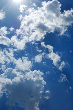Vital flight in the free, dark blue and gentle sky through dense clouds