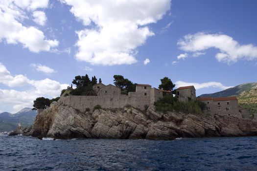 A stony island in mediterrian sea with a st.stefan church in montenegro