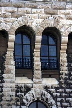 Adorable windows of the medieval castle designed in the form of arch