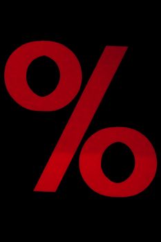 Red sign for percentage on the black backgrounf